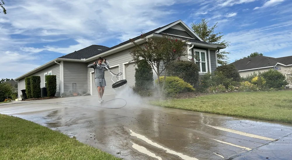 Freshly soft-washed home exterior and driveway